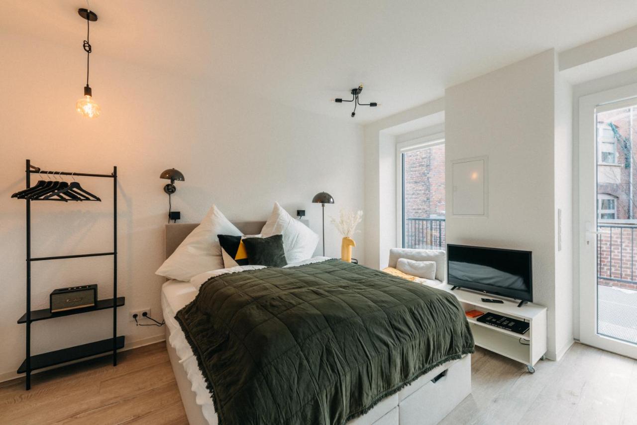 Cozy sleeping area of a BHH Living apartment in Dusseldorf